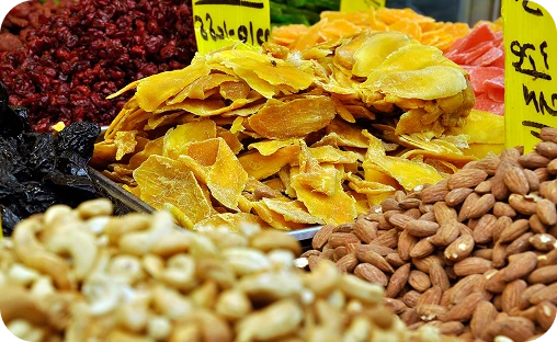 Assorted dry snacks including wafers, nuts, and fruit chips manufactured by Launch My Brand