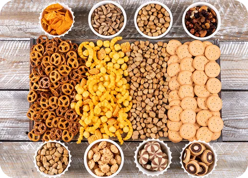 Flatlay of various snack products such as namkeen, cookies, and roasted mixes by Launch My Brand